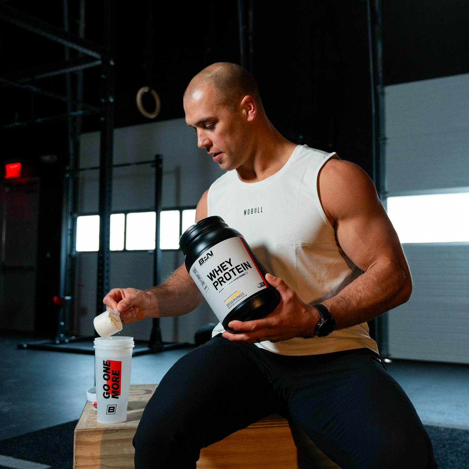 An athlete taking BPN Whey Protein Powder